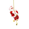 a santa clause hanging from a gold chain