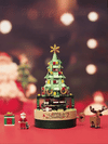 a small christmas tree is on a table