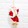 a santa clause ornament hanging from a chain