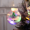 a christmas ornament hanging from a christmas tree