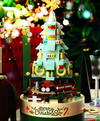a christmas tree made out of legos in front of a christmas tree