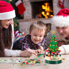a family playing with a lego christmas tree