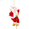 a santa clause ornament hanging from a chain
