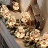 a mantle covered in snow globes and christmas decorations